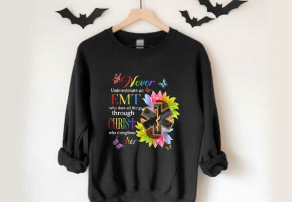 Never Emt Christ Her Shirt, Never Underestimate An Emt Who Does All Things Through Christ Who Strengthens Her Shirt