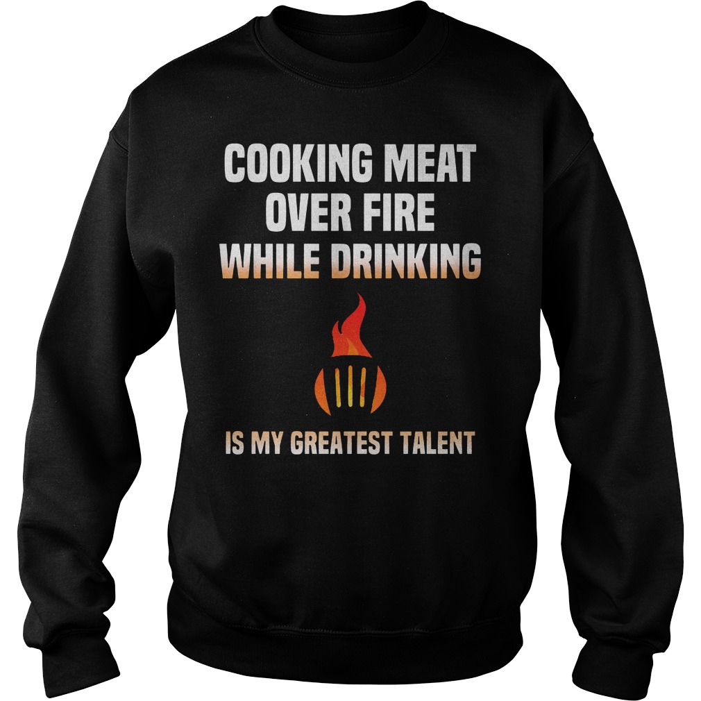 Cooking Meat Over Fire While Drinking Sweater