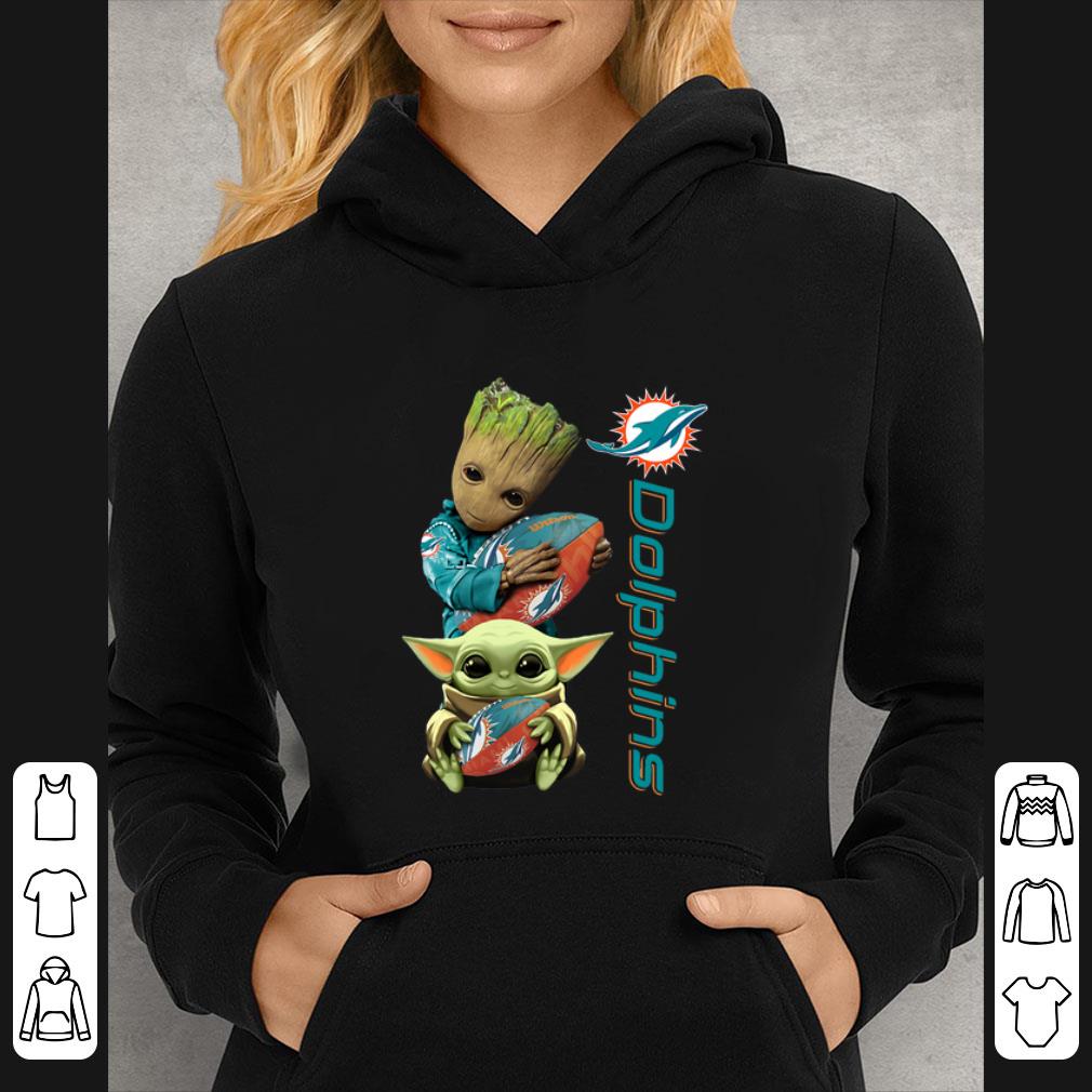 d83a979d pretty baby groot and baby yoda hug miami dolphins shirt 4 - Pretty Baby Groot And Baby Yoda Hug Miami Dolphins shirt