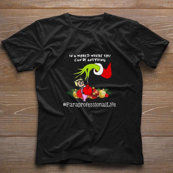 Top Hand Grinch Holding Ornaments In A World Where You Can Be Anything Paraprofessional Sweater shirt