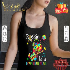 Dinosaur T Rex Rockin to a different tune Autism awareness shirt